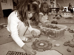 Students create patterns with Legos and other toys in Mr. Sarda’s class