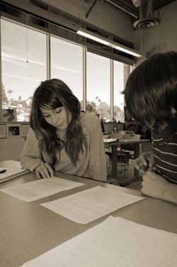 An 11th grader and a 9th grader critique each other’s work