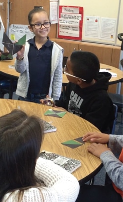 Young students working with semitransparent geometric models