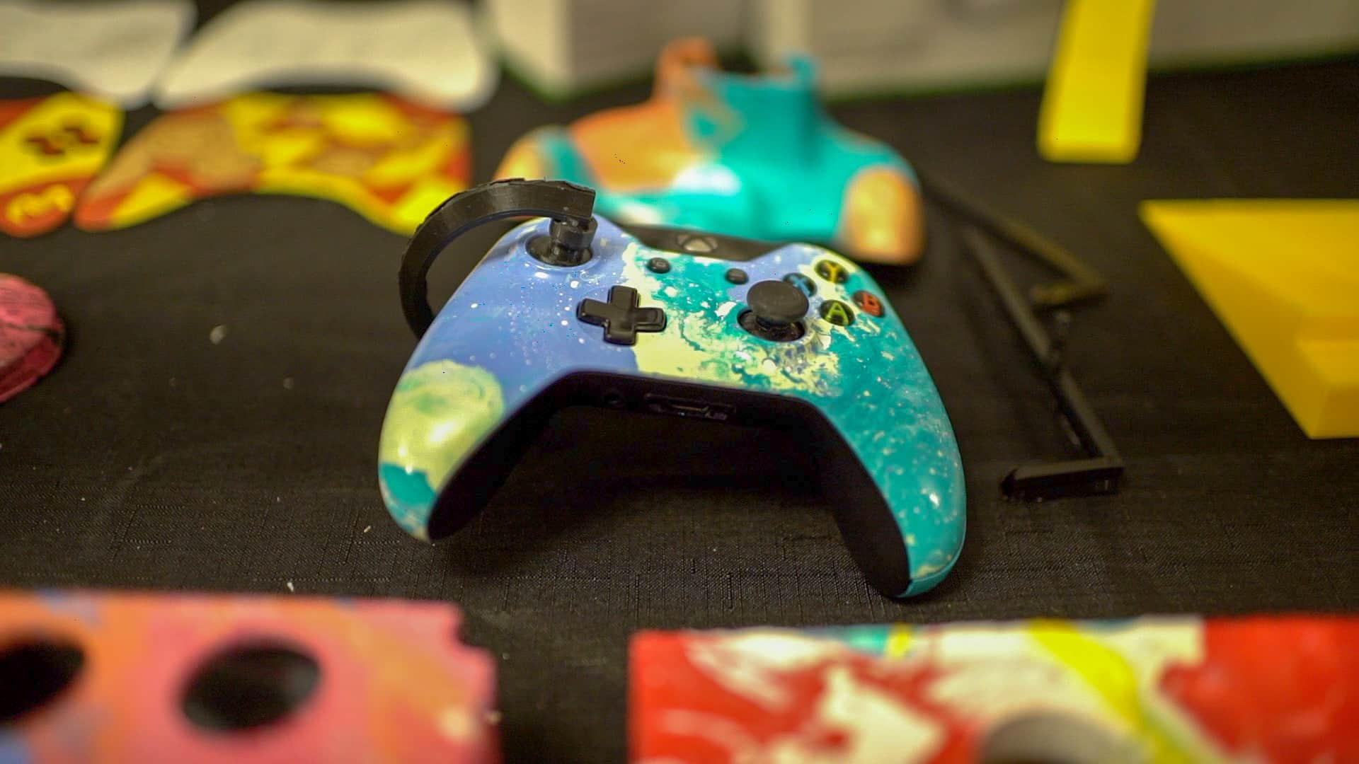 Image of a modified Xbox controller, allowing single-handed use of the dual joysticks