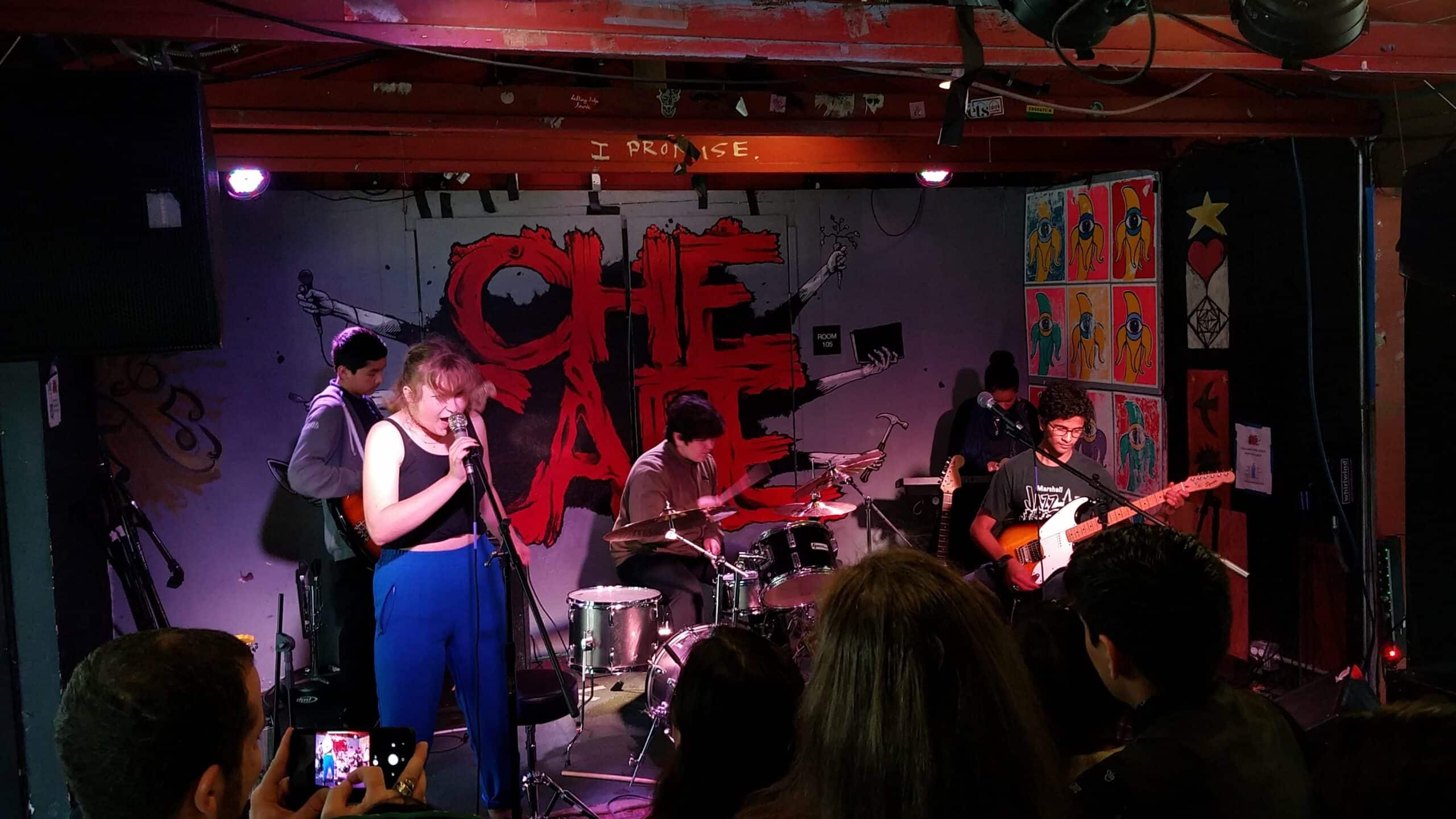 Students in a rock band at Che Cafe