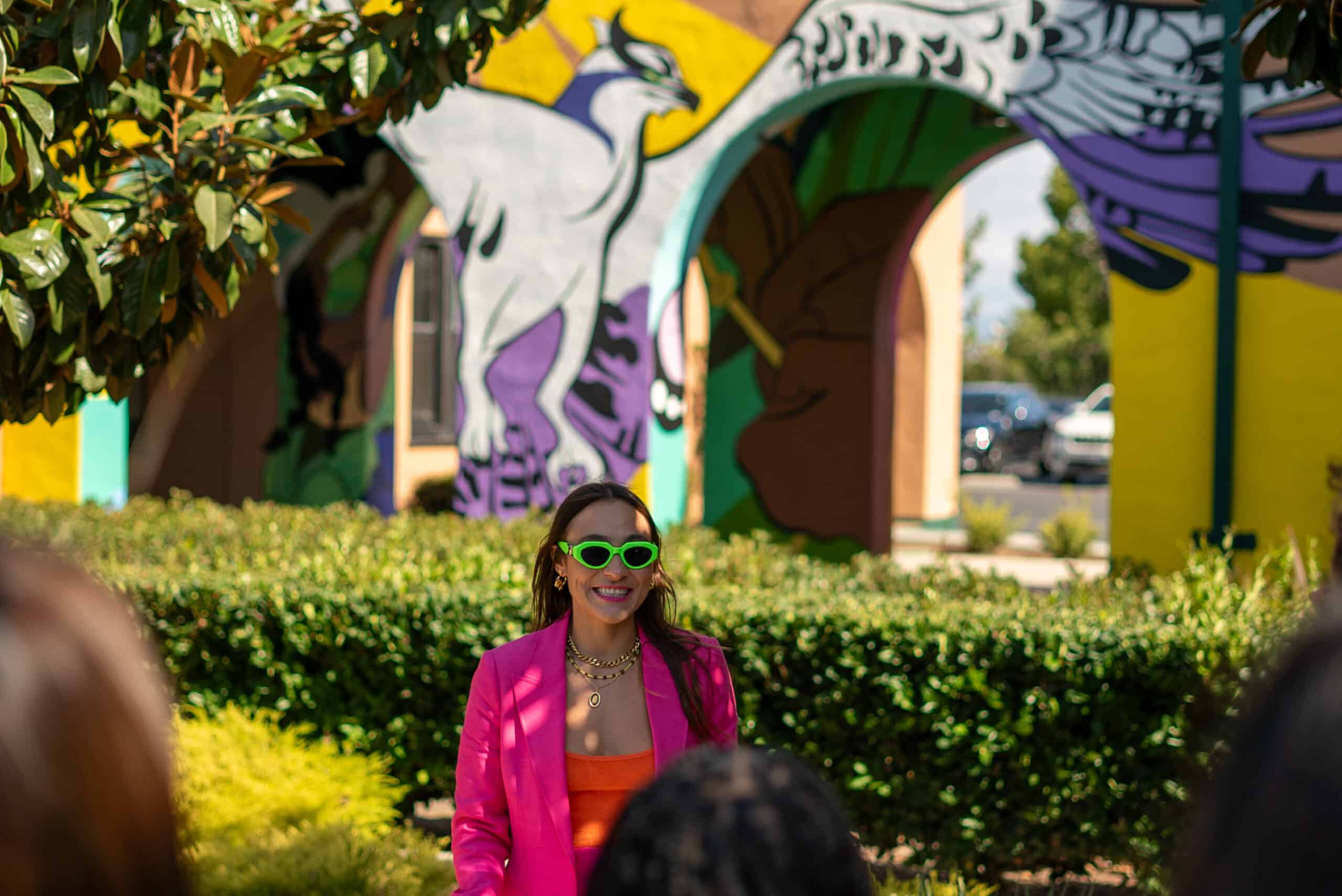 Scarlett in front of the Liberty Station mural