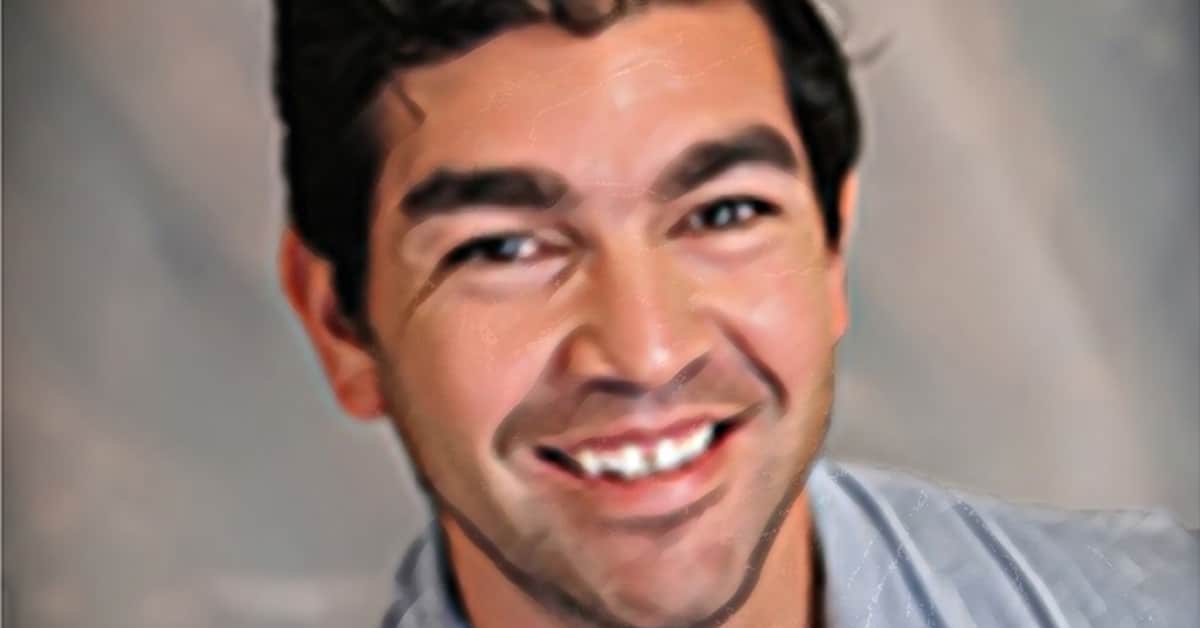 A smiling man with curly dark hair and a light-colored shirt is depicted in a stylized, painted portrait with soft, blended colors and a neutral background, reminiscent of Chris Olivass artistic flair.