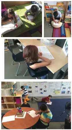 Students in a classroom engage in various learning activities: reading on a carpet, writing at a desk, seated at a round table, and sitting on the floor against a wall. Bookshelves and colorful decor are visible.