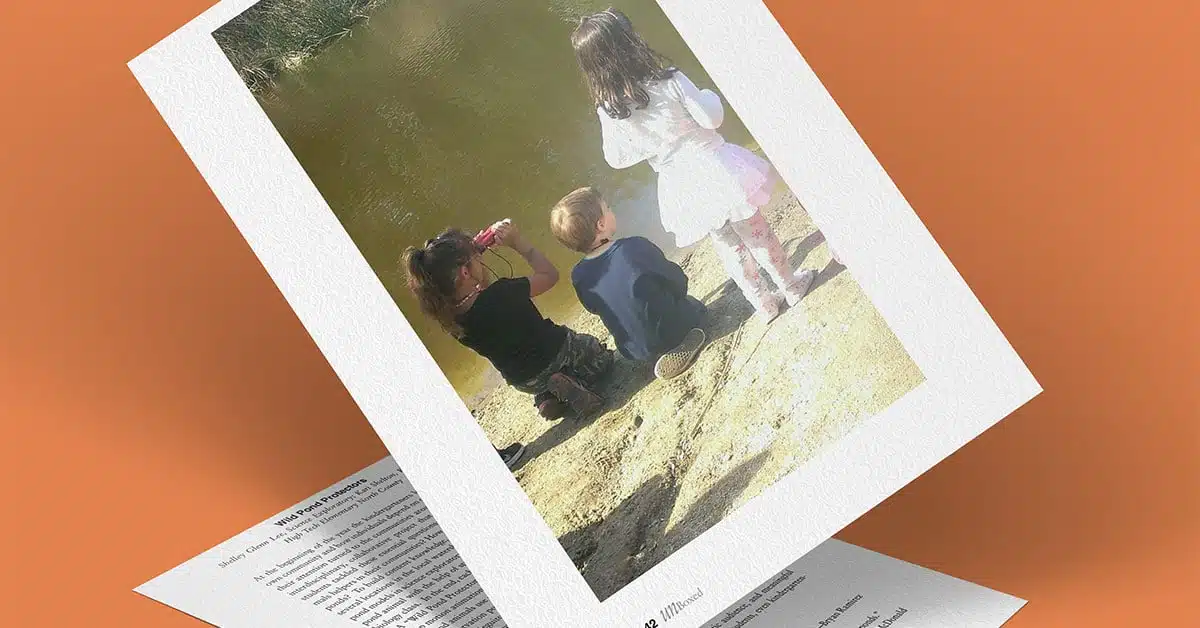 A photo of three children by the pond, two girls standing and one boy crouching as proud Wild Pond Protectors. The image is printed on textured paper and set against an orange background, partially covering text on another page.