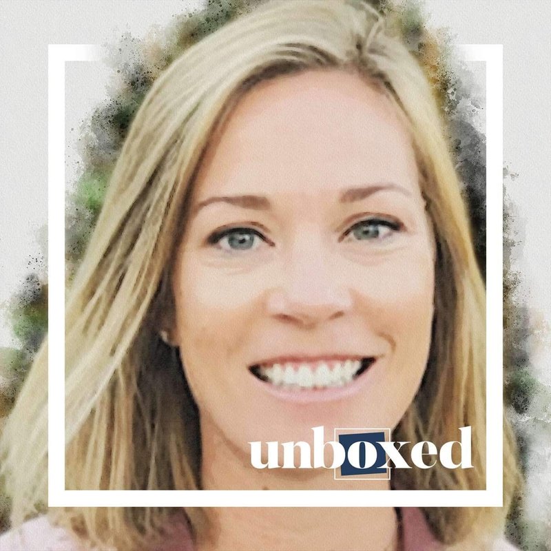 A smiling person with shoulder-length blonde hair embodies the spirit of Teach Us. The word unboxed is overlaid on the image, symbolizing how real data can empower students to unlock their full potential.