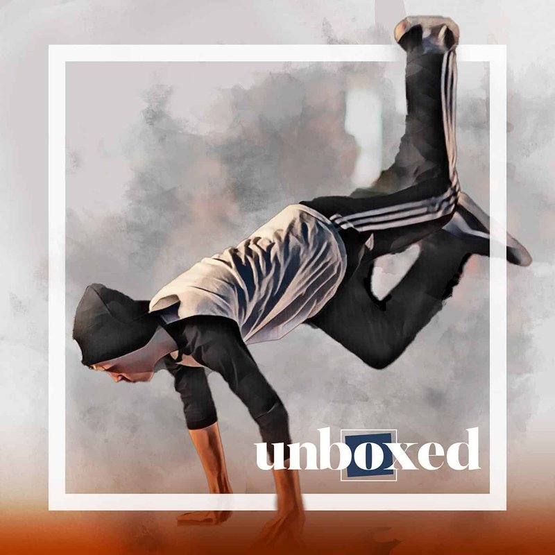 A person in a beanie and casual attire performs a dynamic breakdance move, balancing on one hand. The word unboxed is overlayed on the image, framed by a white square. The background evokes an abstract design reminiscent of after-school creativity and energy.