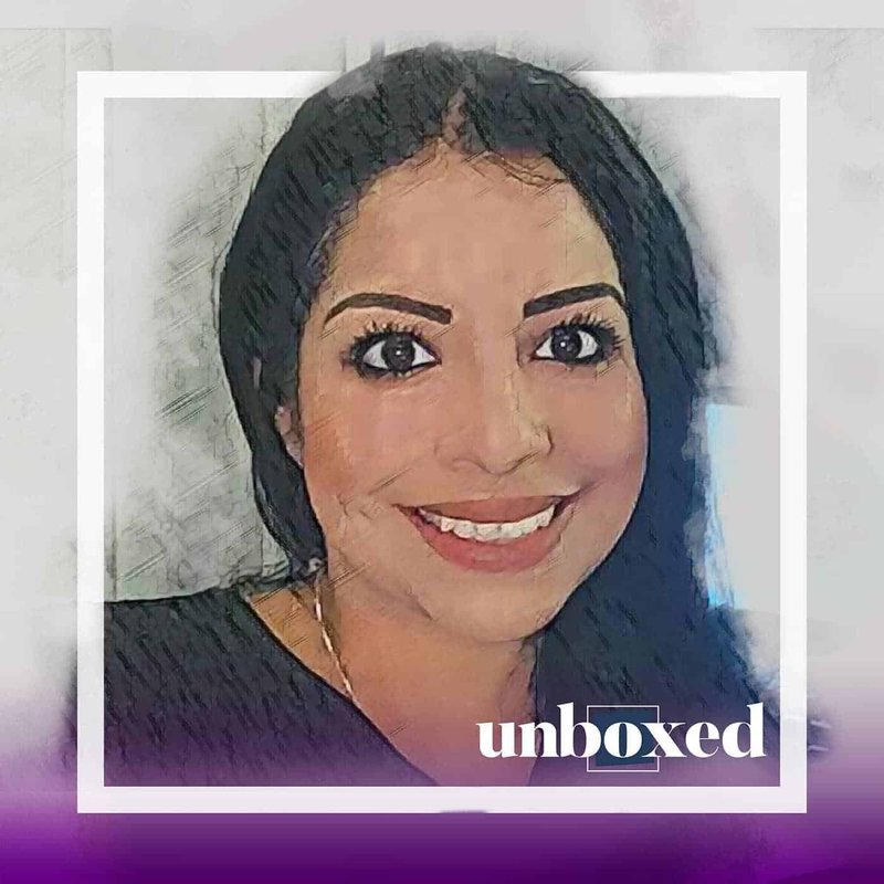 Illustration of a smiling woman with long dark hair, wearing a black top. The background features a soft gradient, with unboxed elegantly scripted in the lower right corner. This image goes beyond simple aesthetics, symbolizing empowerment and the importance of teaching consent.