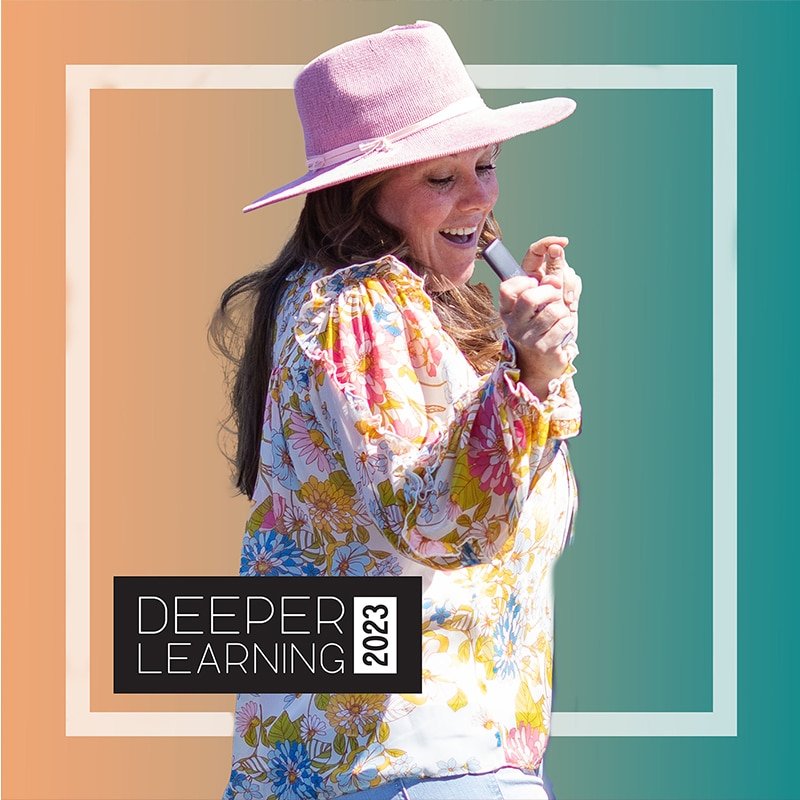 A person wearing a pink hat and floral blouse, smiling brightly, stands outdoors against a gradient background. The words Deeper Learning 2023 are prominently displayed in the corner, capturing the spirit of innovation championed by 2nd Grade Teacher Kristin DeLaTorre.