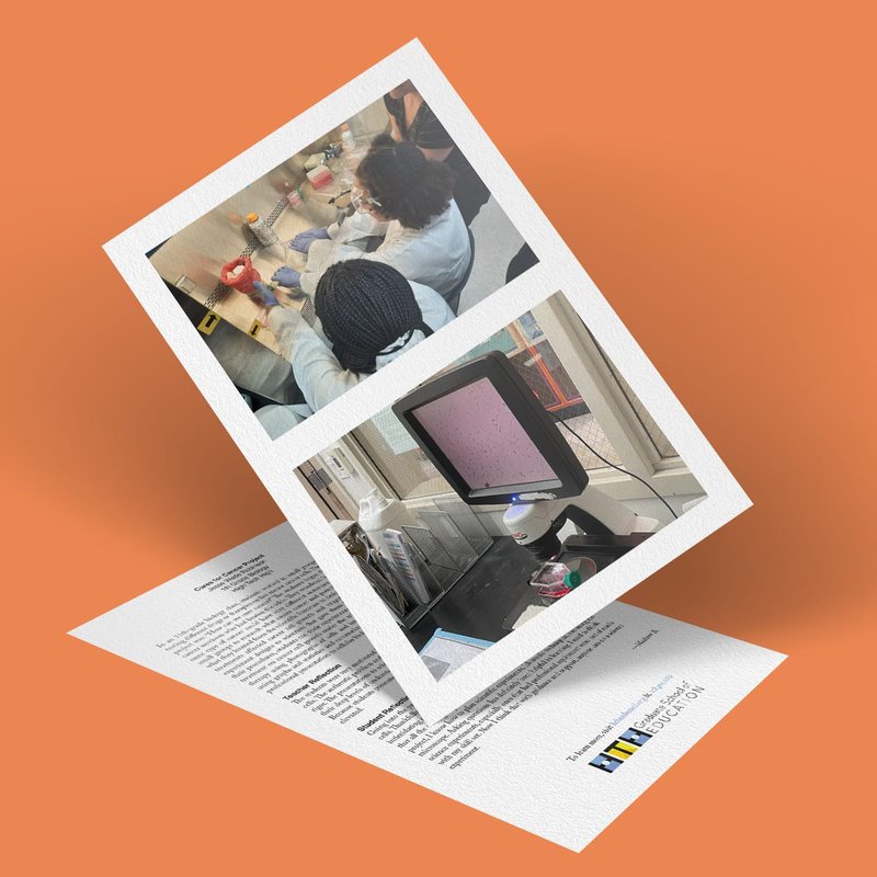 A tilted paper displays two photos: one shows people working on a Cancer Project in a lab, focusing on a desk with lab equipment; the other photo shows a computer screen with data. The paper is placed on a larger document against an orange background.