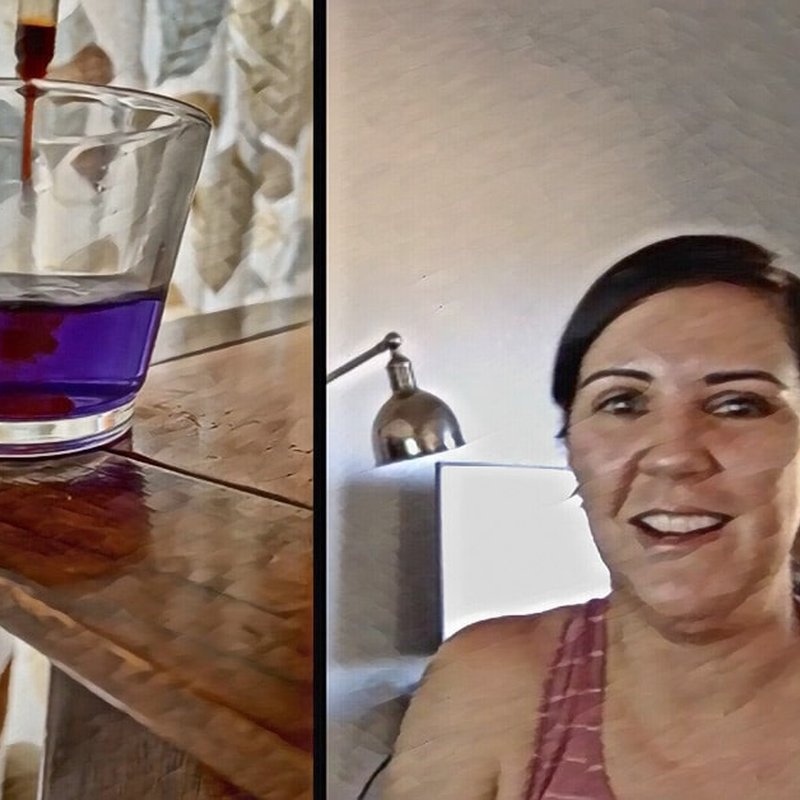 A split image: on the left, a glass with a purple liquid on a wooden surface; on the right, a person with dark hair smiles while sitting indoors at home, with a lamp and part of a picture frame in the background.