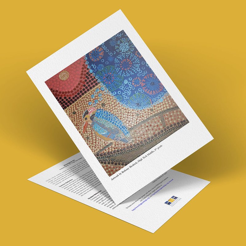 A greeting card adorned with Aboriginal art showcases colorful dots and patterns. The card stands above another paper with text, all set against a mustard yellow background.