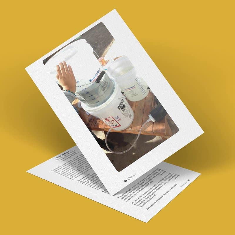 A printed page leans against another, featuring a photo of a hand touching a large plastic container connected to a smaller one with tubing, set on a wooden table. The background is a solid mustard yellow color, evoking the timeless connection between water and our worlds history.