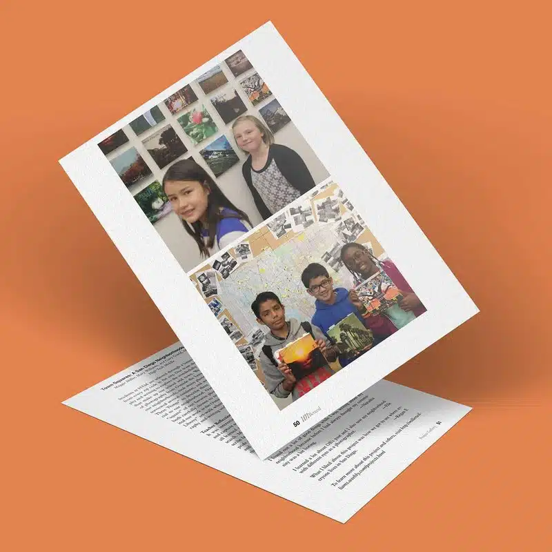 A tilted sheet displays photos of students. The top image shows two girls standing in front of a picture display, possibly from a San Diego neighborhood. The bottom image features three boys holding books with a map in the background. Another sheet lies partially visible underneath.