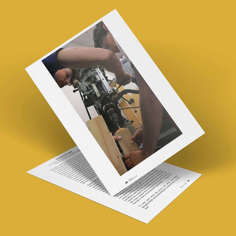 A photo of people using a machine, possibly a drill press, mounted on a wooden block in an upcycle project. The image is angled on top of a yellow surface, layered over a sheet of text. The setup suggests an industrial or workshop environment focused on sustainable practices.