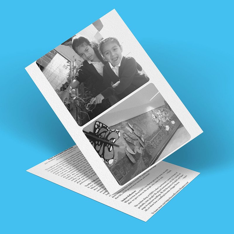 A greeting card with a textured cover features two black and white photos of children smiling and playing, alongside a mural painting depicting the life cycle of a butterfly. The card is artfully set against a serene blue background.
