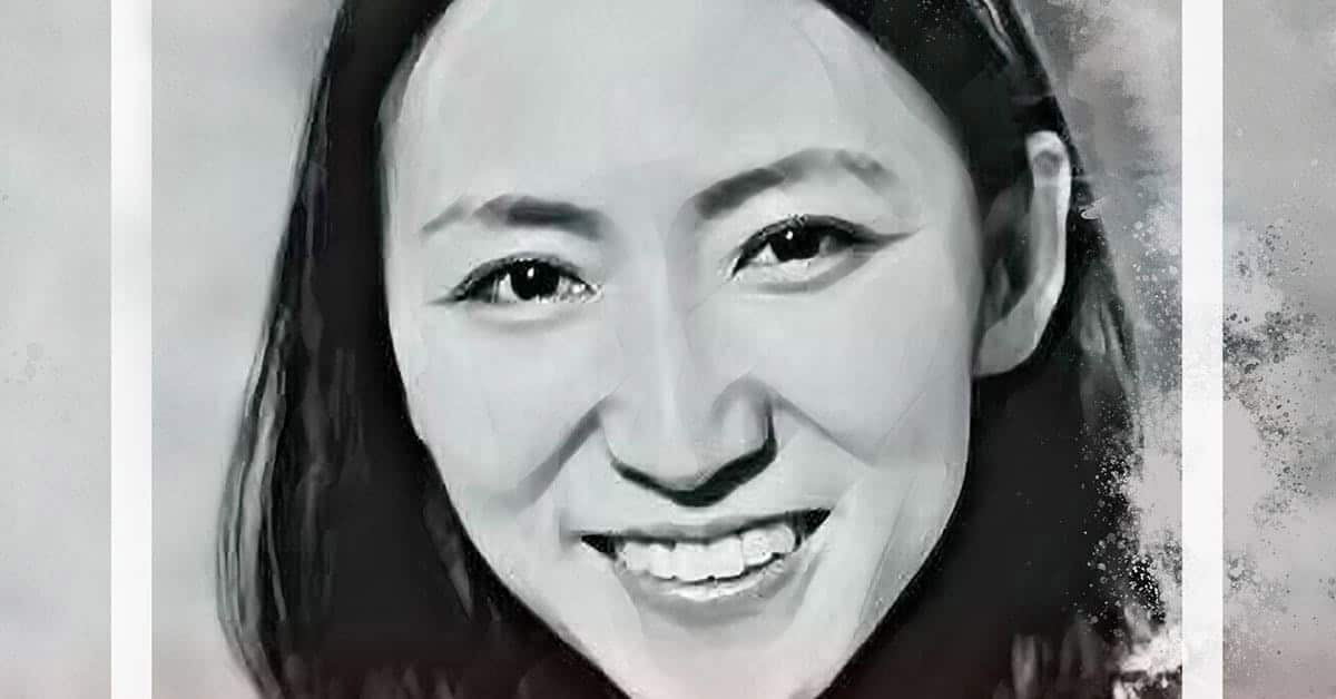 A grayscale digital portrait of a woman smiling, reminiscent of an ETU School masterpiece. The artwork features brushstroke textures, creating an artistic effect. Its blurred background enhances the subjects face, capturing timeless elegance akin to ancient artistry found near the Forbidden City.