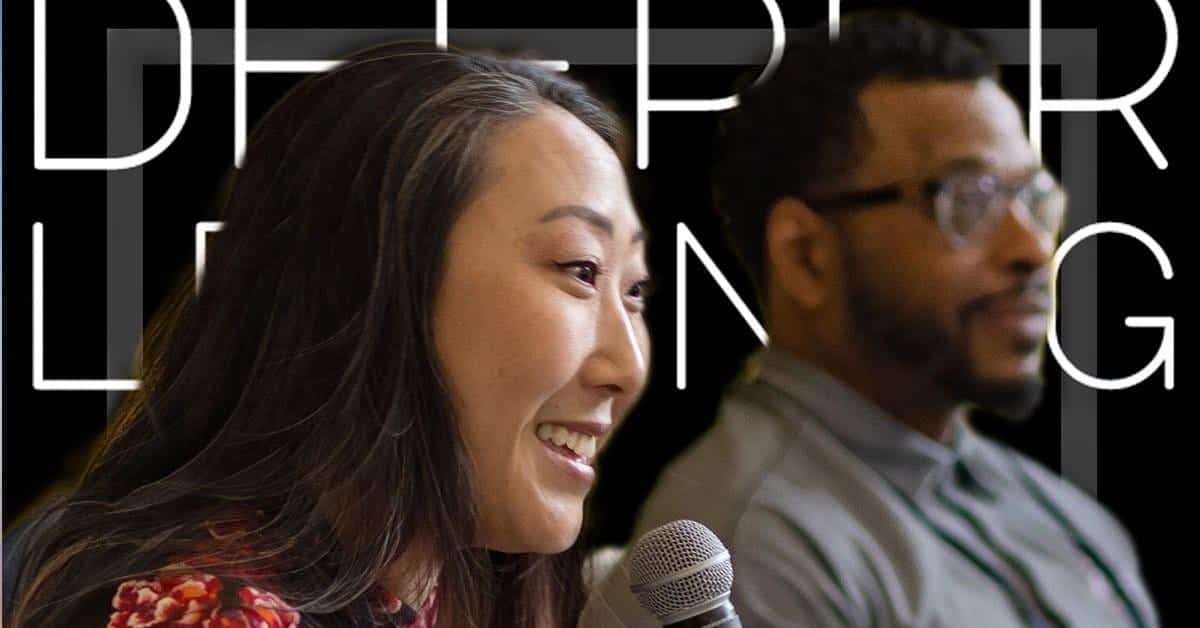 A woman holding a microphone smiles and speaks, embodying the spirit of Deeper Learning. Beside her, a man in glasses looks forward with keen interest. In the background, the partial text DEEP LEARNING hints at the Equity Centers commitment to progress.