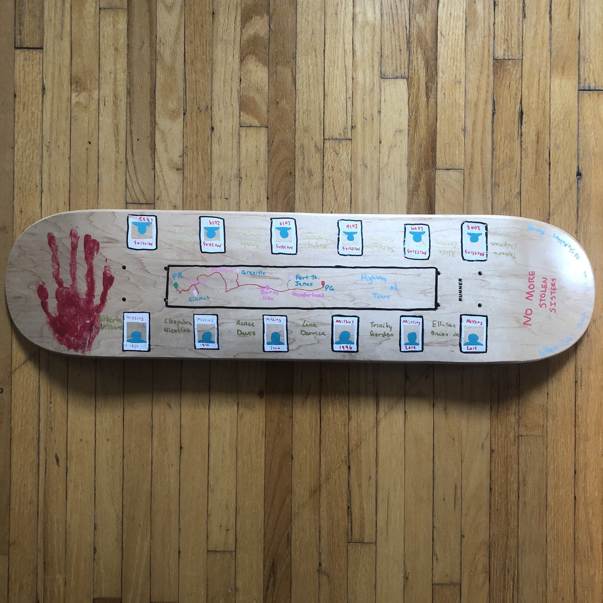 Skateboard deck showing the path of the "Highway of Tears" in Canada and names of Missing and Murdered Indigenous Women
