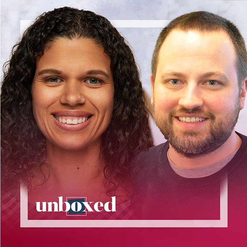 A woman with curly dark hair and a man with short light hair and a beard are smiling. The word unboxed appears at the bottom of the image, which has a red gradient border, highlighting their commitment to transforming math instruction.