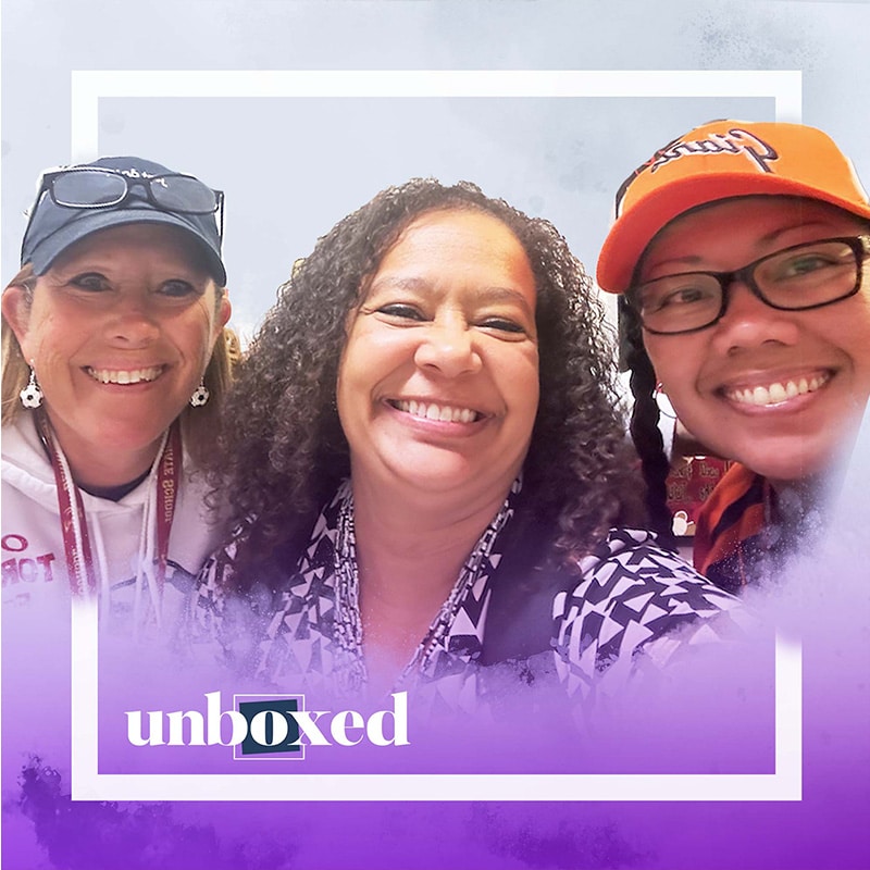 Three smiling women pose together for a selfie. The image has a purple border at the bottom with "unboxed" written in white and blue letters, capturing a joyful moment from the latest Bernal episode.