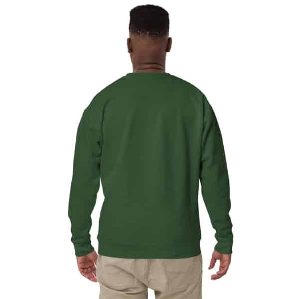 A person is standing with their back to the camera, wearing a forest green Unisex Crew Neck Sweatshirt with a subtle white logo and beige pants against a plain white background.