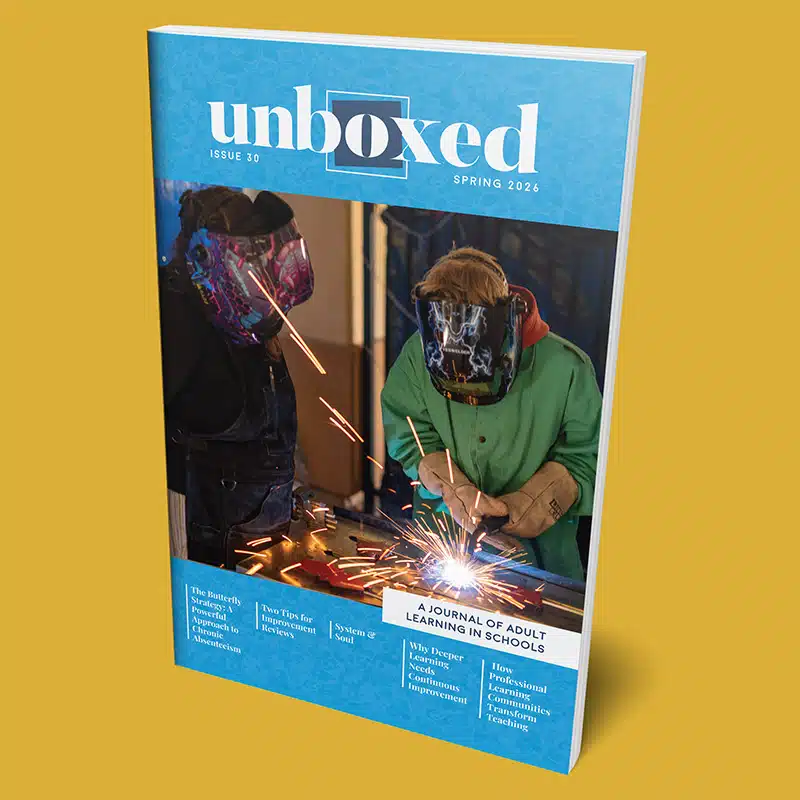 Cover of “Unboxed” Issue 30, Spring 2026, shows two people in welding helmets working with metal as sparks fly. The tagline reads, A Journal of Adult Learning in Schools, with featured articles listed at the bottom.