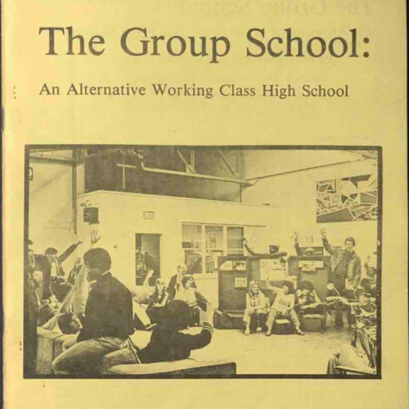 Yellowed 1981 book cover titled The Group School: An Alternative Working Class High School, featuring a black-and-white photo of students and a teacher in a classroom, several students raising their hands.